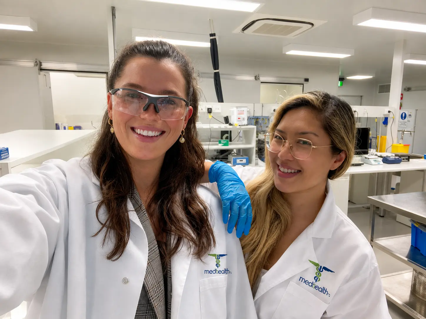 Two researchers working in a Medhealth laboratory environment