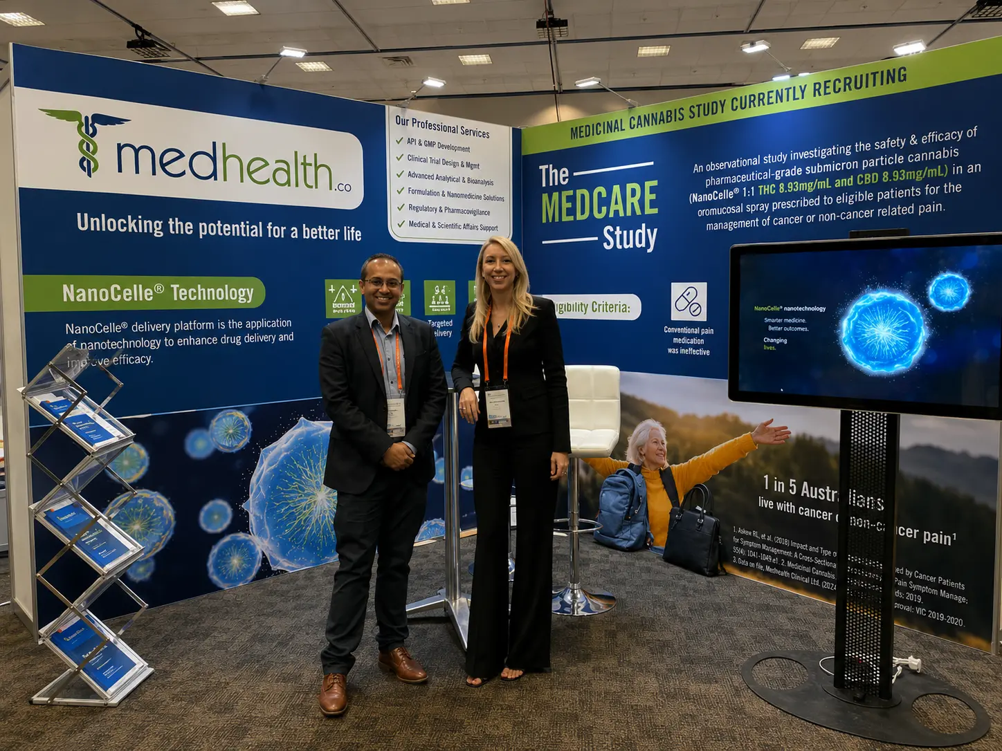 Medhealth representatives beside a NanoCelle exhibition display